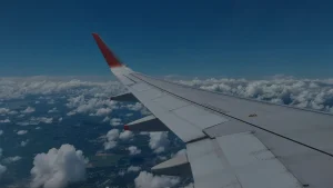 Airplane wing above the clouds